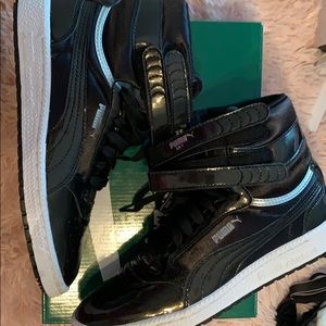 Black puma high tops with silver detail